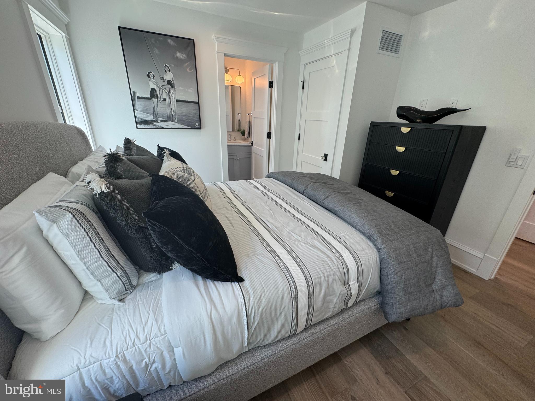 281 7th Street Avalon, NJ 08202 - Photo 12 of 62 a bedroom with a bed and a mirror