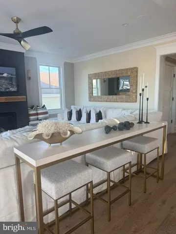 a view of a balcony with couch and wooden floor