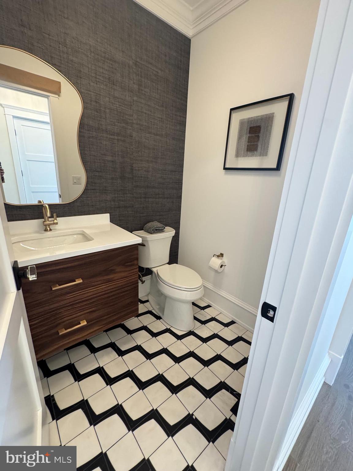 281 7th Street Avalon, NJ 08202 - Photo 31 of 62 a bathroom with a mirror and a toilet