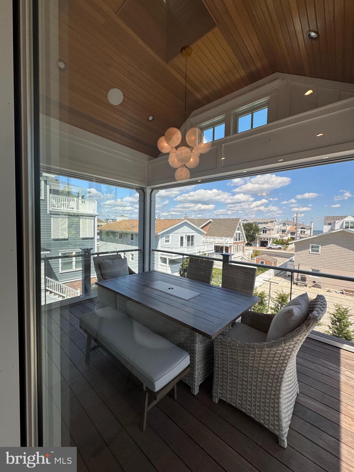 281 7th Street Avalon, NJ 08202 - Photo 34 of 62 a view of a balcony with couch and wooden floor