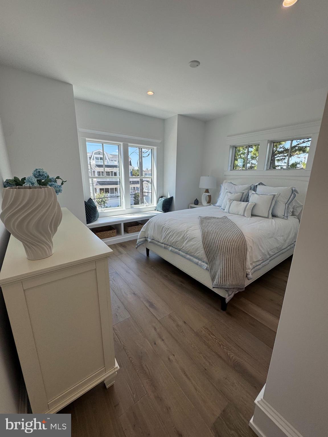 281 7th Street Avalon, NJ 08202 - Photo 36 of 62 a bedroom with a bed and wooden floor