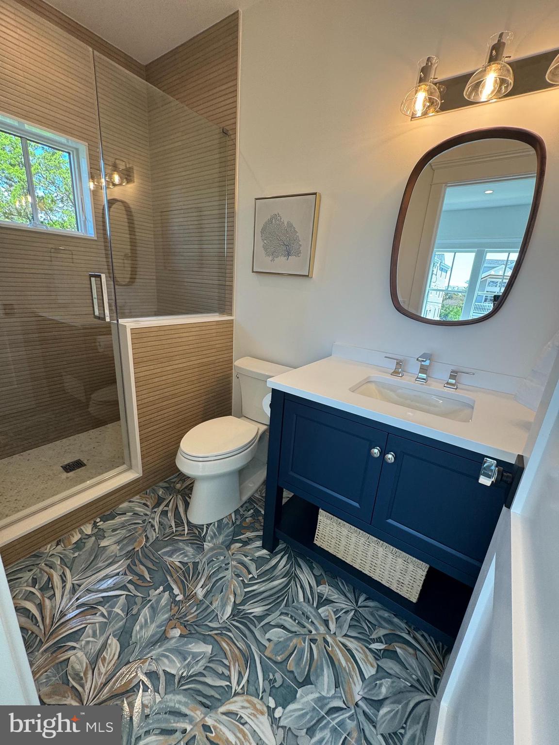 281 7th Street Avalon, NJ 08202 - Photo 37 of 62 a bathroom with a toilet sink and mirror