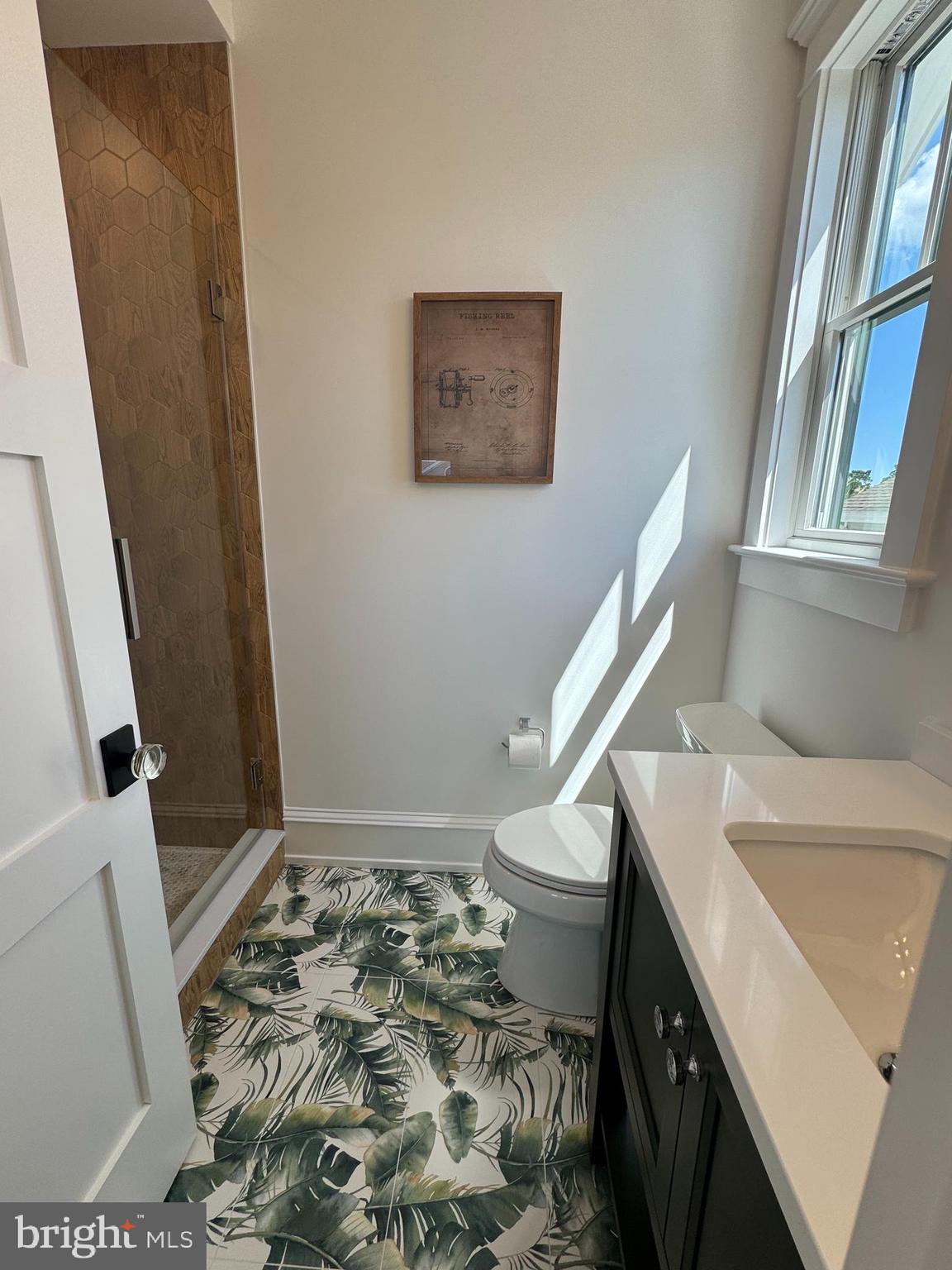 281 7th Street Avalon, NJ 08202 - Photo 40 of 62 a bathroom with a sink and a mirror