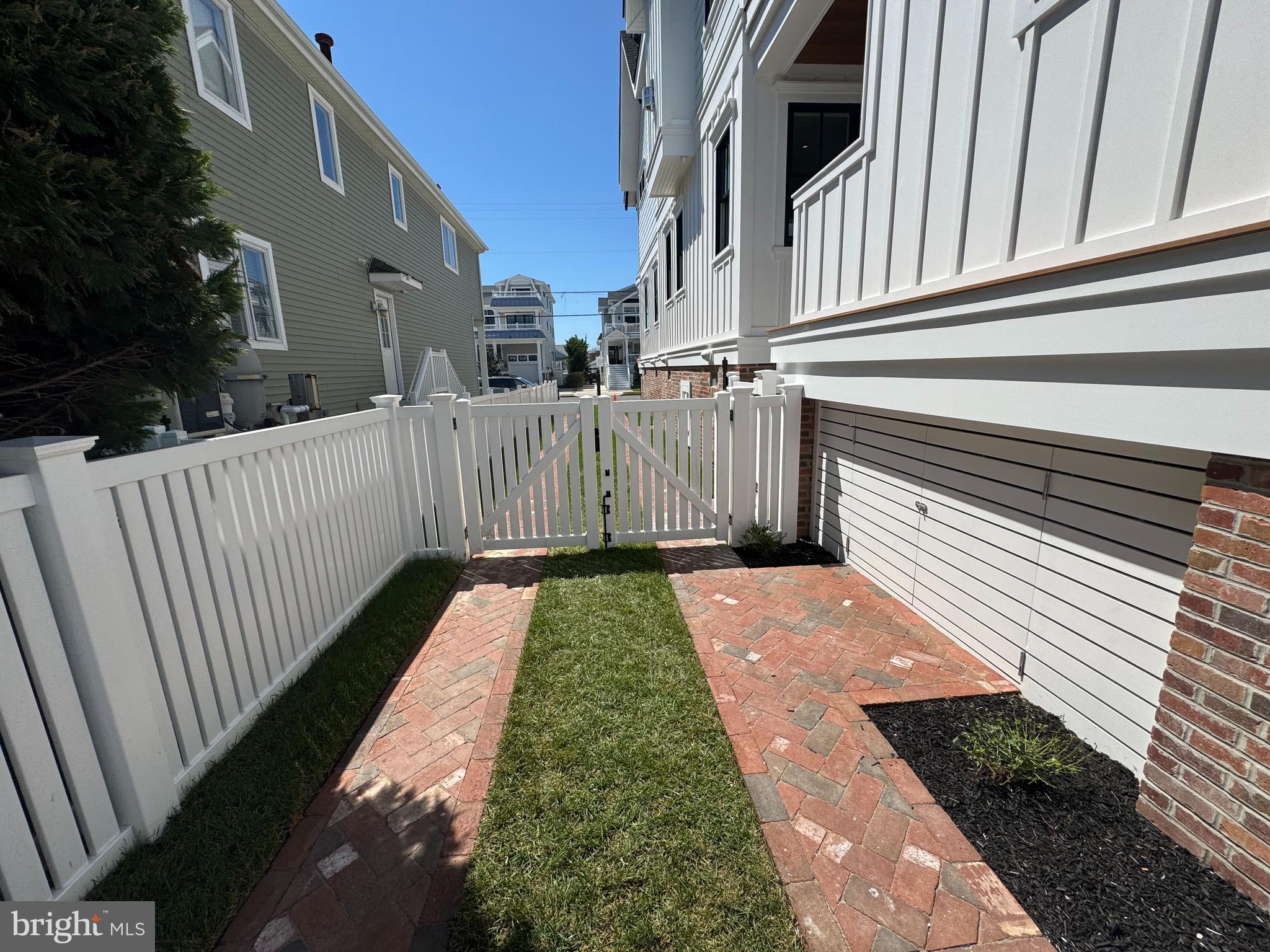 281 7th Street Avalon, NJ 08202 - Photo 54 of 62 a view of a pathway of a house with backyard and stairs