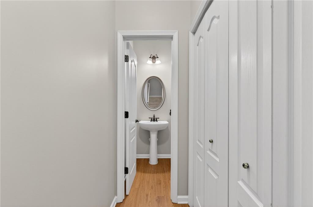 1186 Lake Point Way Suwanee, GA 30024 - Photo 11 of 35 wooden floor in a gallery