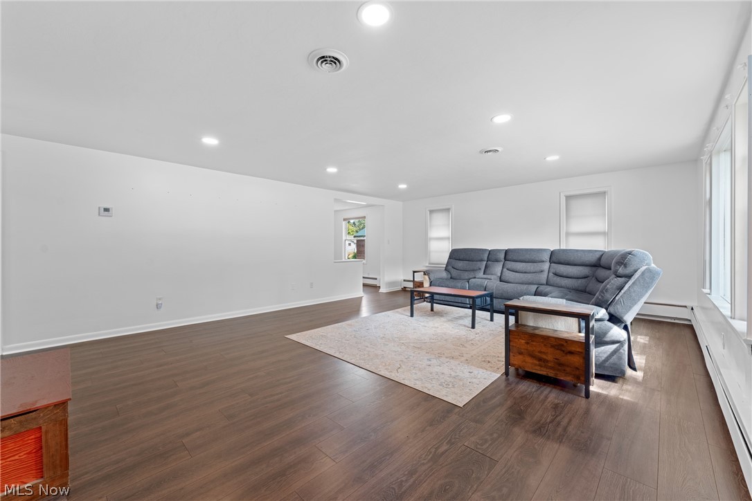 2941 Copley Road Akron, OH 44321 - Photo 14 of 44 Living room with dark wood-style floors, recessed lighting, and baseboard heating