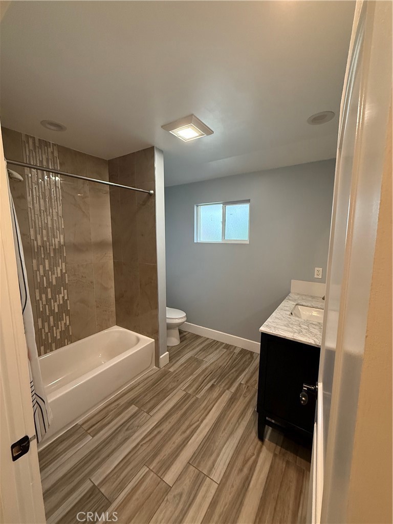 7459 Ruffner Avenue Van Nuys, CA 91406 - Photo 15 of 20 a bathroom with a sink and shower