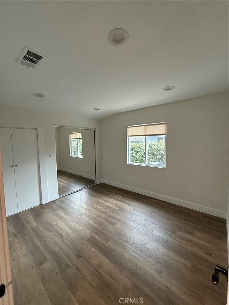 7459 Ruffner Avenue Van Nuys, CA 91406 - Photo 17 of 21 wooden floor in an empty room with a window
