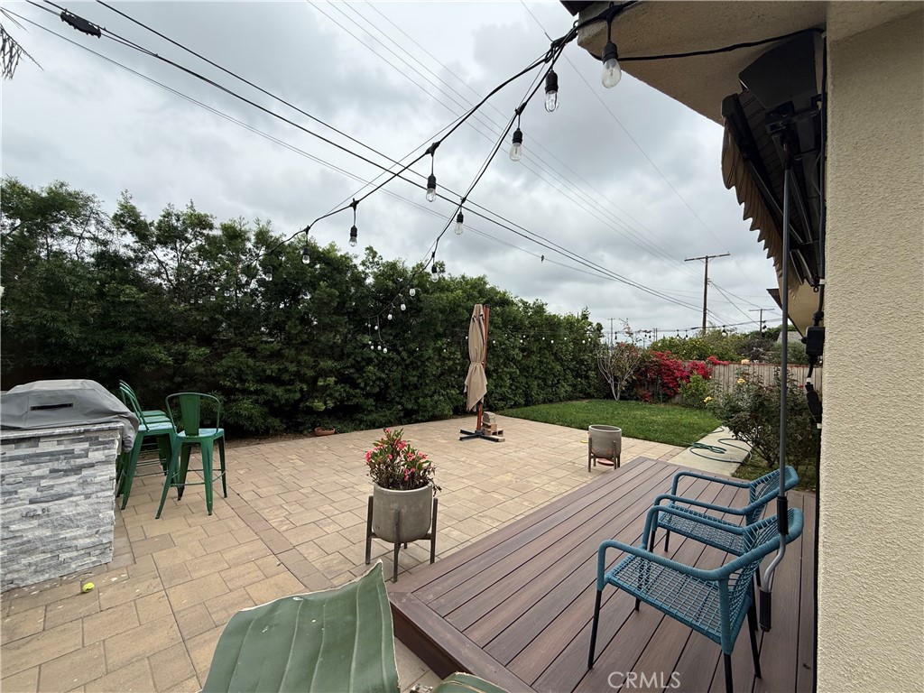 7459 Ruffner Avenue Van Nuys, CA 91406 - Photo 20 of 21 a view of a patio with table and chairs and potted plants