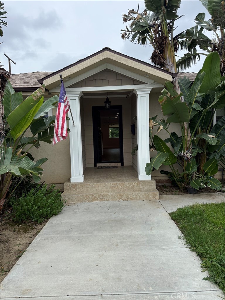 7459 Ruffner Avenue Van Nuys, CA 91406 - Photo 3 of 20 a front view of a house with garden