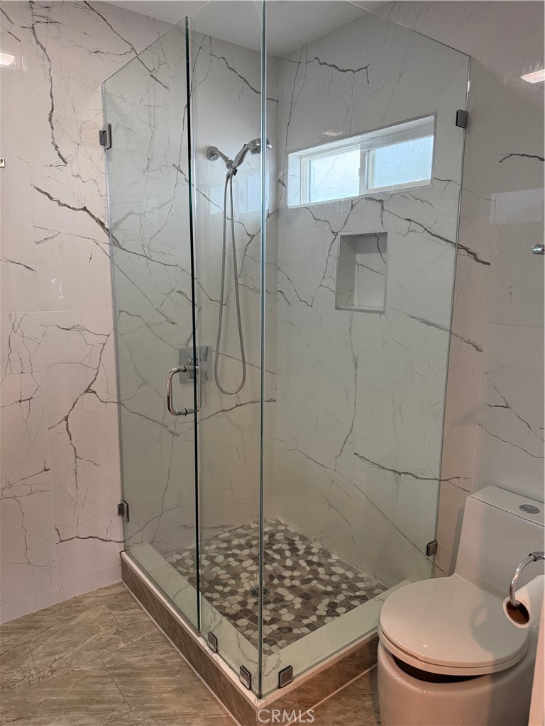 7459 Ruffner Avenue Van Nuys, CA 91406 - Photo 7 of 20 a bathroom with a shower