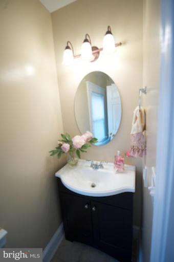1808 Kinship Road Dundalk, MD 21222 - Photo 4 of 19 a bathroom with a sink and a mirror