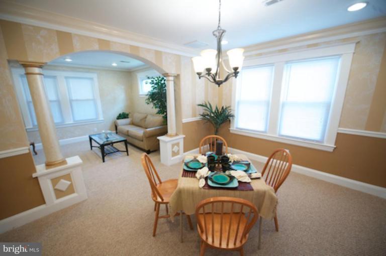 1808 Kinship Road Dundalk, MD 21222 - Photo 5 of 19 a view of a dining room with furniture window and wooden floor