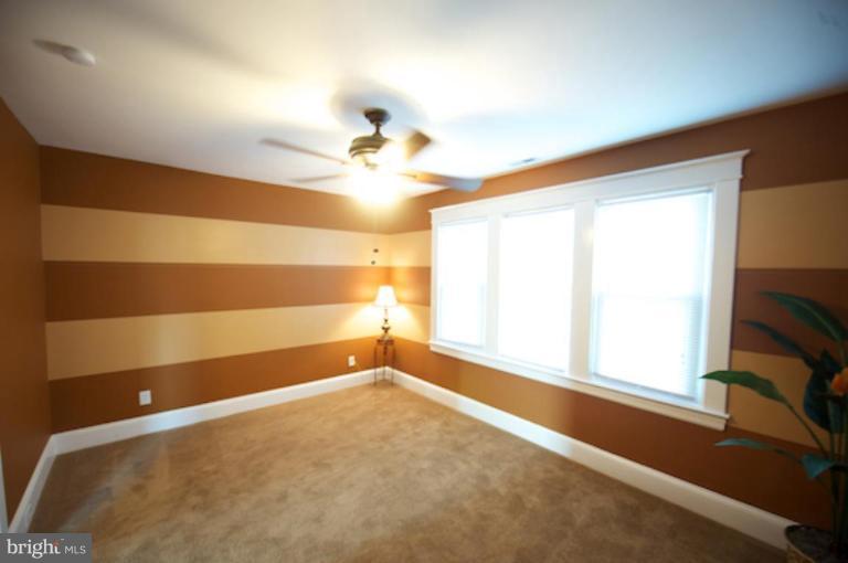 1808 Kinship Road Dundalk, MD 21222 - Photo 9 of 19 a view of room with a ceiling fan and window