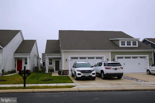 a view of a car parked in front of a house