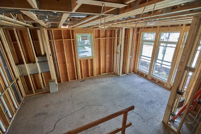 a tall building with trees in front of it