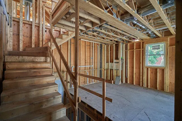 a front view of a building with tree s