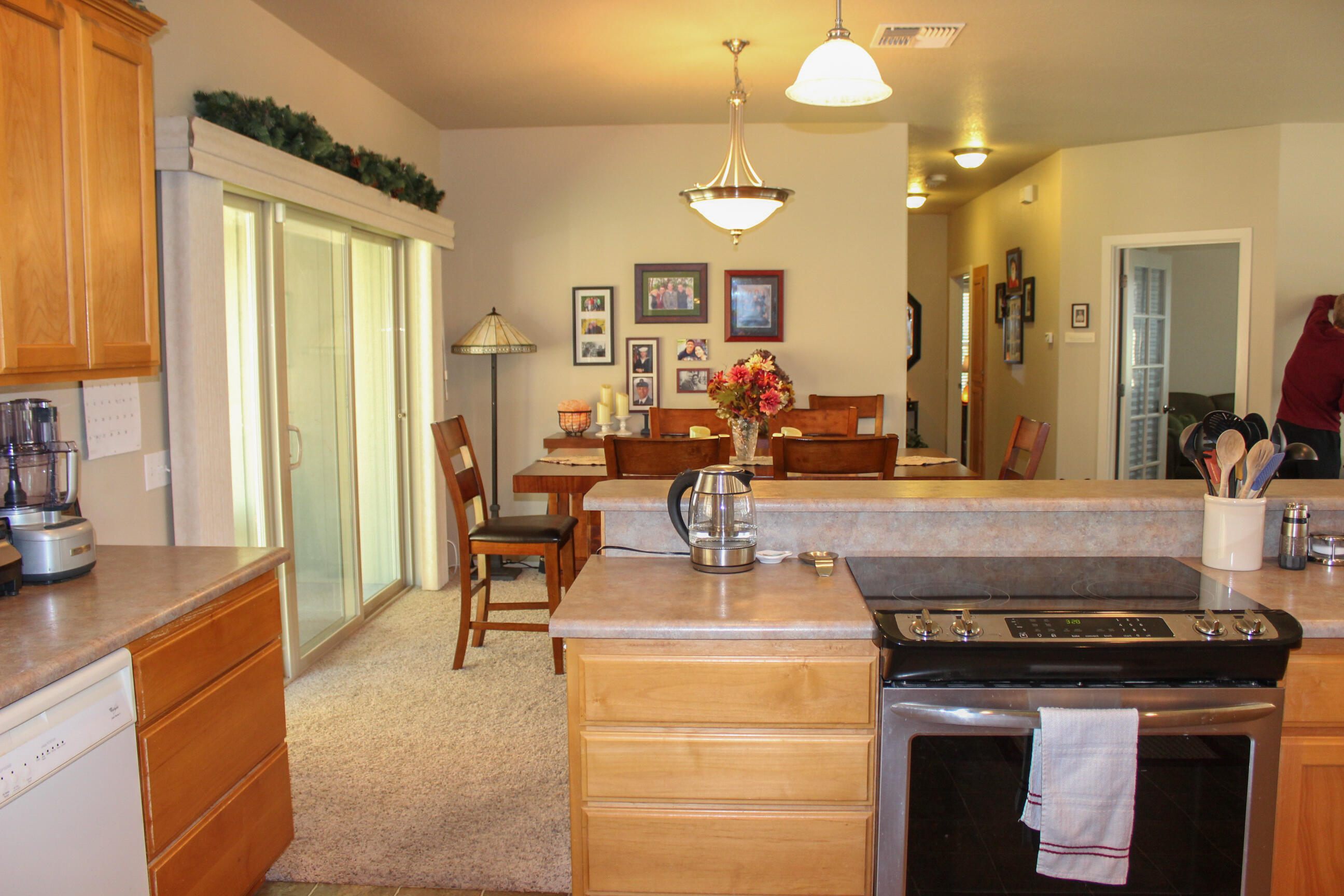 705 Three Pines Road Grants Pass, OR 97526 - Photo 21 of 47 a kitchen with a stove and a view of living room