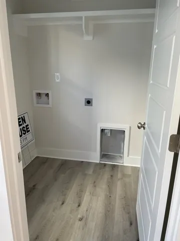 a view of a room with wooden floor