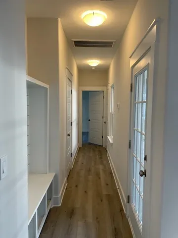 a view of a hallway with a white walls