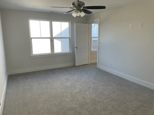 an empty room with a empty space and a window