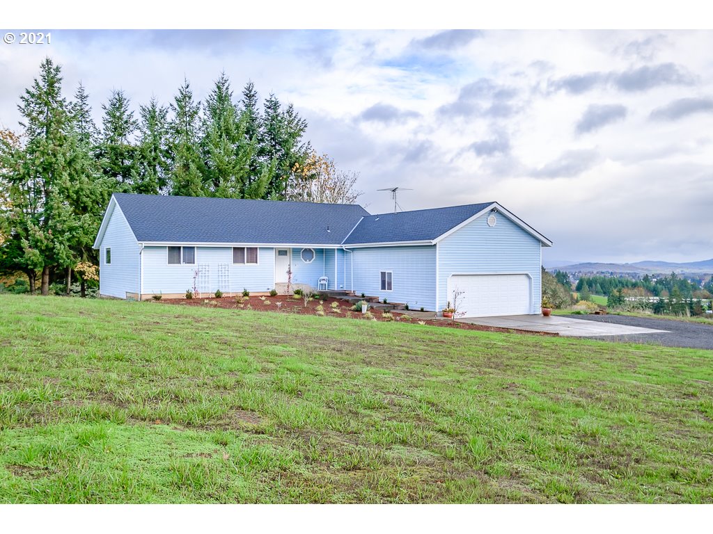 15305 Oakdale Road Dallas, OR 97338 - Photo 2 of 32 a aerial view of a house with table and chairs in a yard