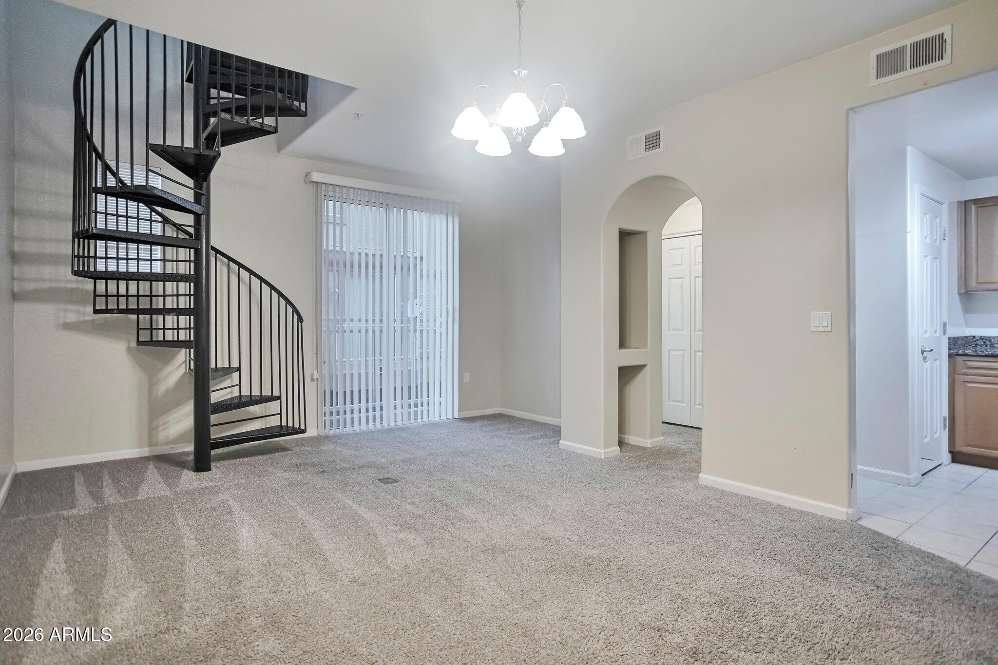1920 East Bell Road, Unit 1006 Phoenix, AZ 85022 - Photo 15 of 25 a view of a livingroom with a staircase