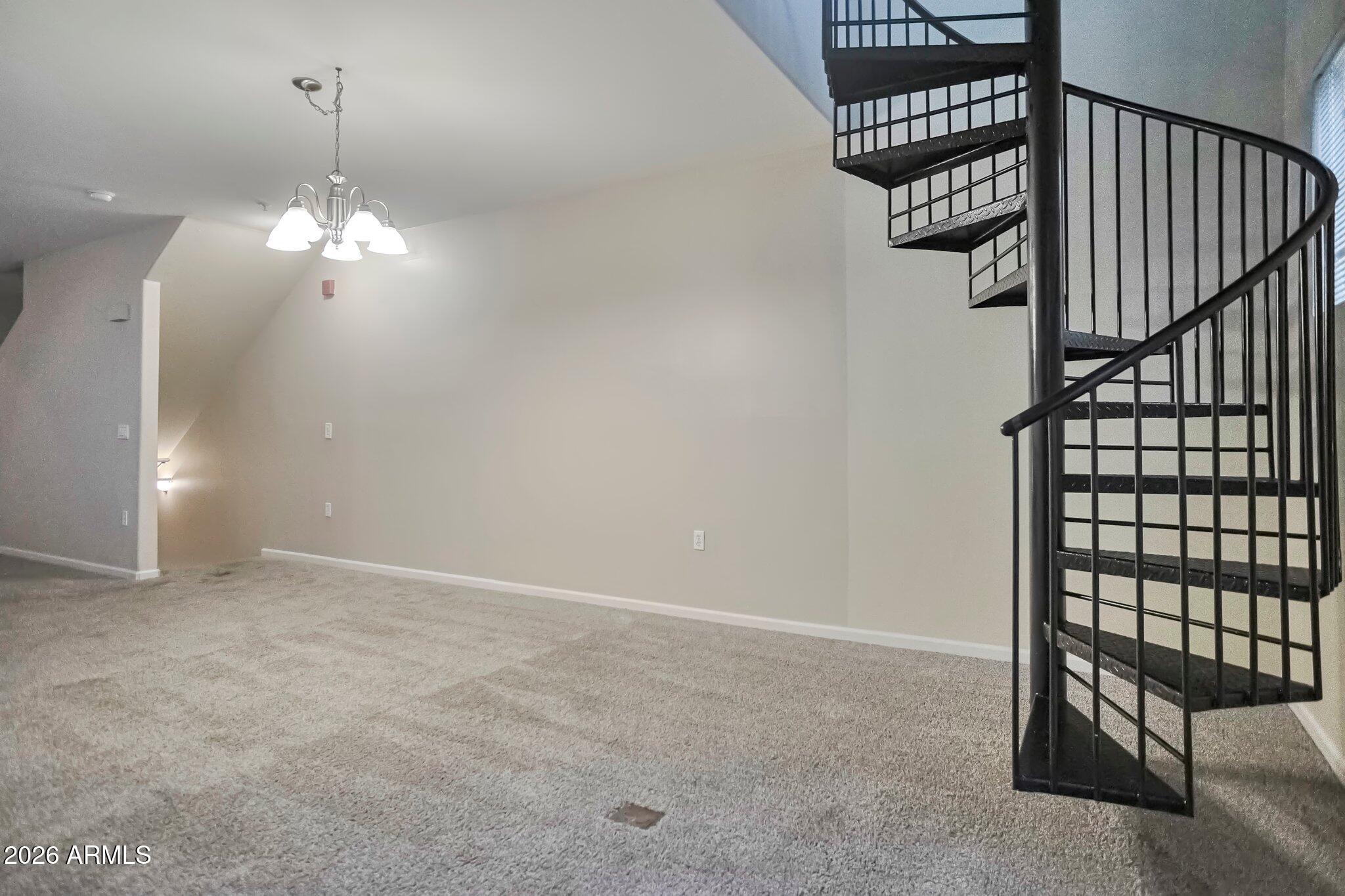 1920 East Bell Road, Unit 1006 Phoenix, AZ 85022 - Photo 16 of 25 a view of a chandelier fan and entryway