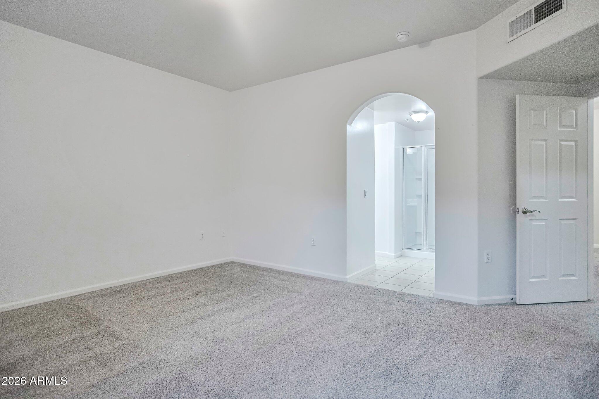 1920 East Bell Road, Unit 1006 Phoenix, AZ 85022 - Photo 21 of 25 an empty room with windows