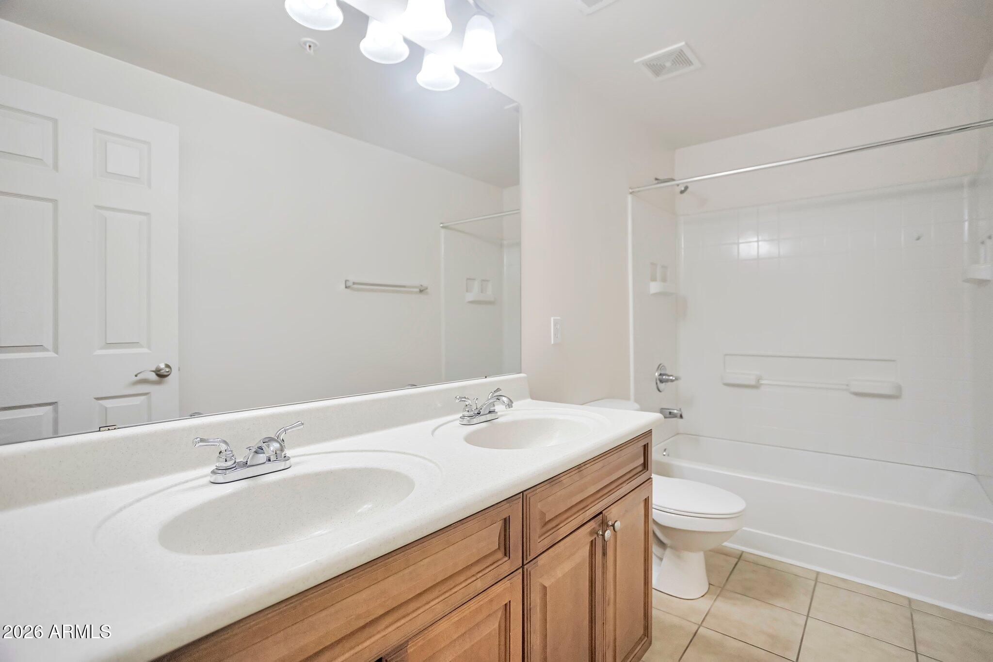 1920 East Bell Road, Unit 1006 Phoenix, AZ 85022 - Photo 24 of 25 a bathroom with a sink a toilet and shower