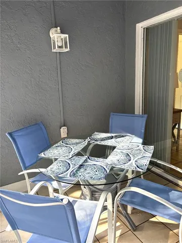 a view of a table and chairs in a patio