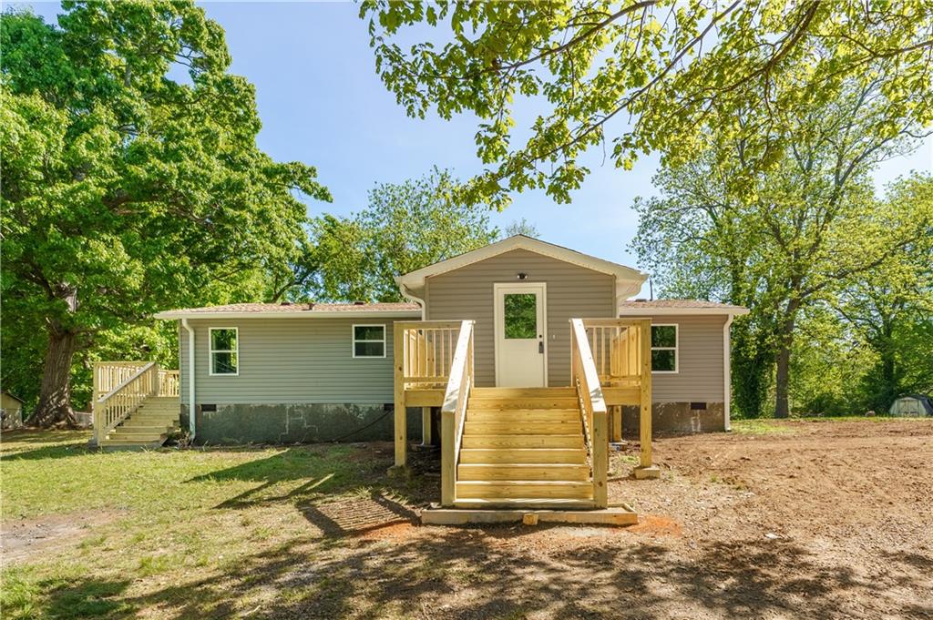 1412 Floyd Circle Gainesville, GA 30507 - Photo 1 of 38 a front view of a house with a yard