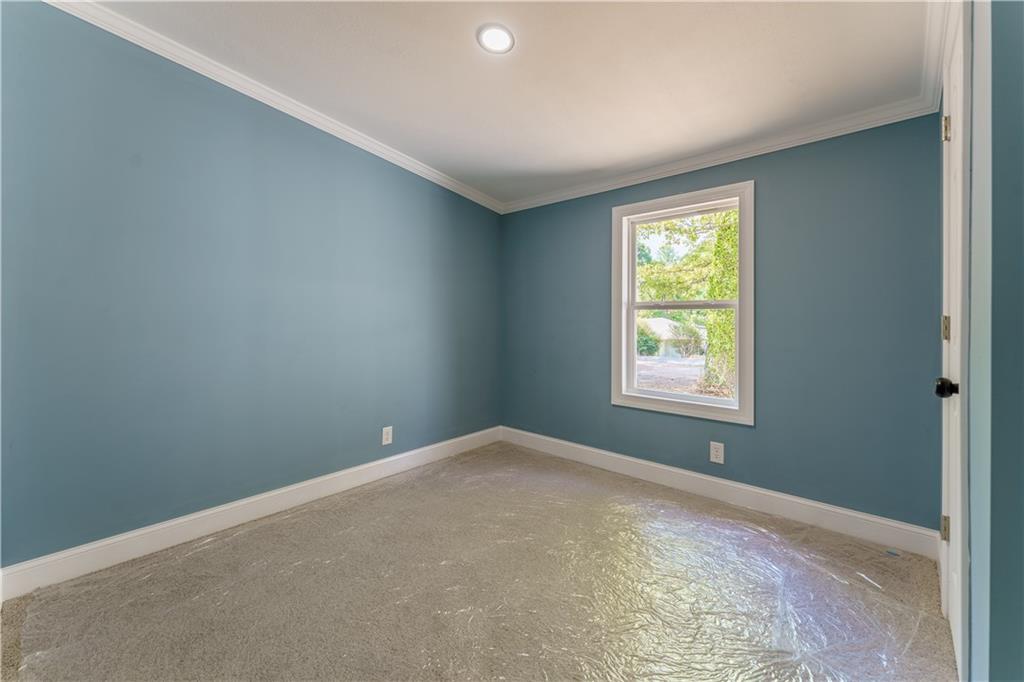 1412 Floyd Circle Gainesville, GA 30507 - Photo 24 of 38 an empty room with windows