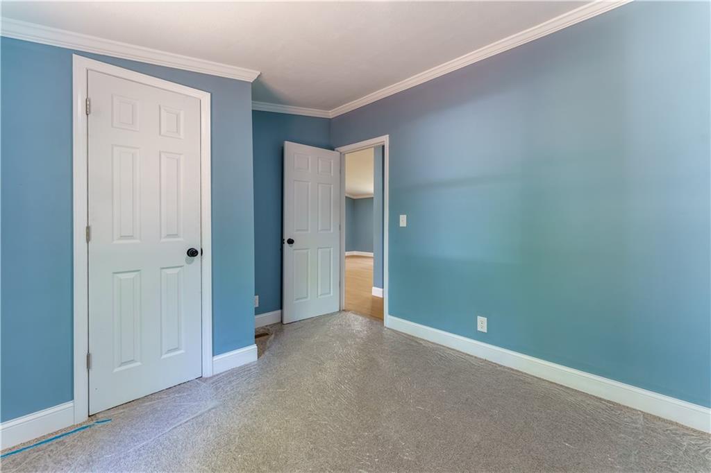 1412 Floyd Circle Gainesville, GA 30507 - Photo 25 of 38 an empty room with closet area