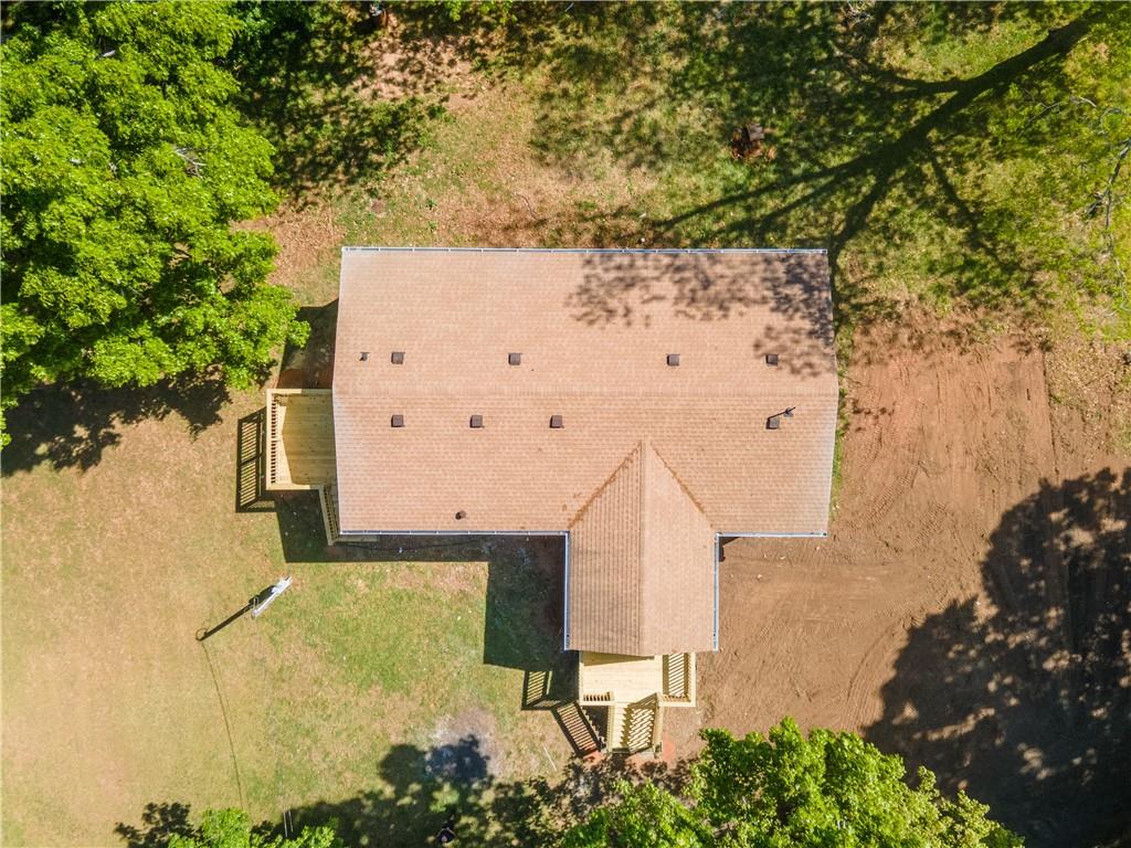 1412 Floyd Circle Gainesville, GA 30507 - Photo 3 of 38 an aerial view of a house with a yard and large trees