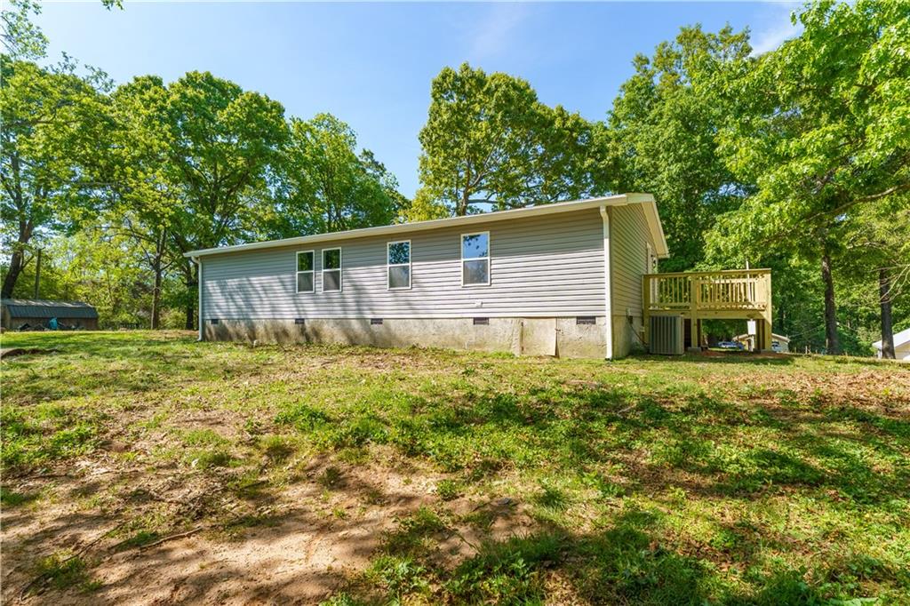 1412 Floyd Circle Gainesville, GA 30507 - Photo 31 of 38 a backyard of a house with barbeque oven and outdoor seating
