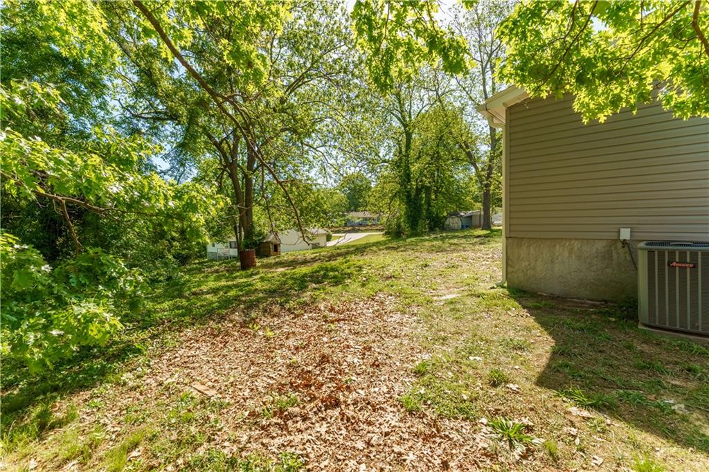 1412 Floyd Circle Gainesville, GA 30507 - Photo 34 of 38 a view of a yard with plants and wooden fence