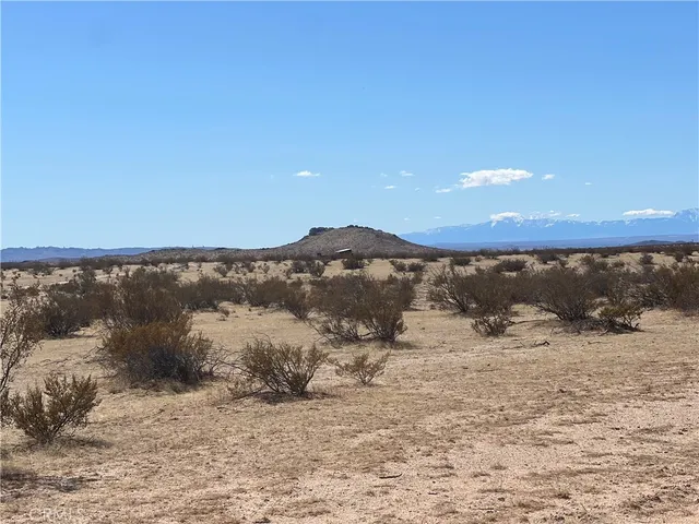 a view of mountain view with mountains in the background