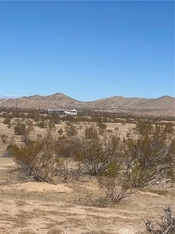 a view of a road with an ocean view