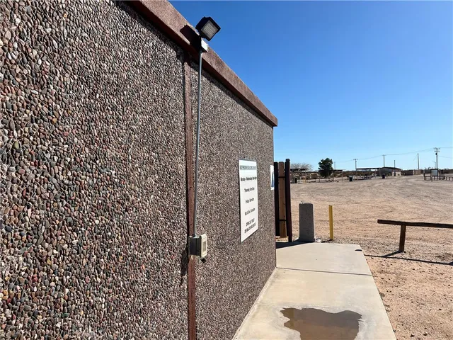 a view of a door and wooden fence