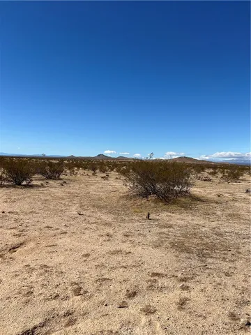 a view of mountain with lake view