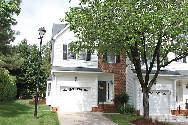5430 Goldenglow Way Raleigh, NC 27606 - Photo 1 of 13 a front view of a house with garden