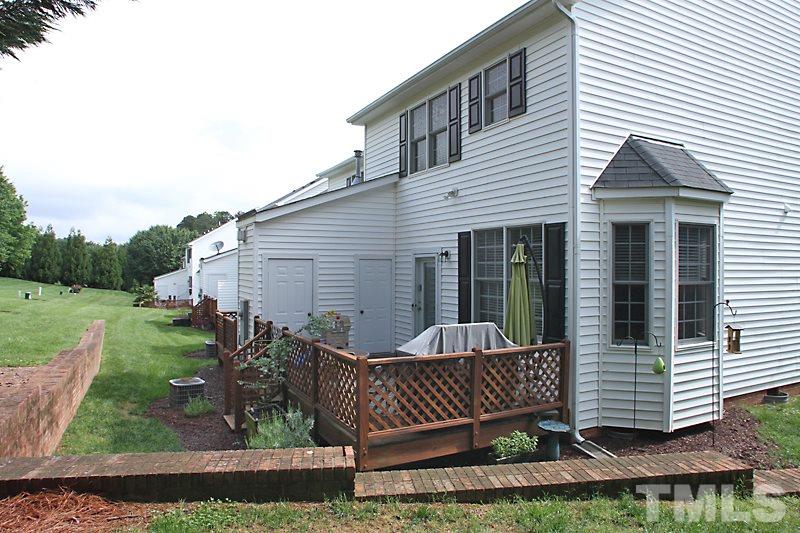 5430 Goldenglow Way Raleigh, NC 27606 - Photo 12 of 13 a view of a house with a yard and furniture