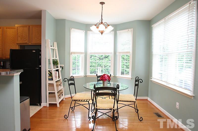 5430 Goldenglow Way Raleigh, NC 27606 - Photo 4 of 13 a dining room with furniture window wooden floor