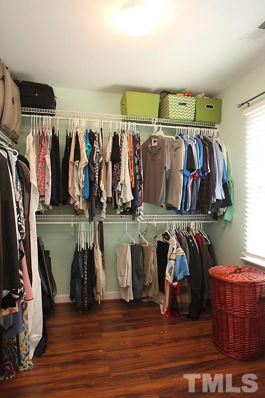 5430 Goldenglow Way Raleigh, NC 27606 - Photo 10 of 13 a view of walk in closet with clothes and shoes