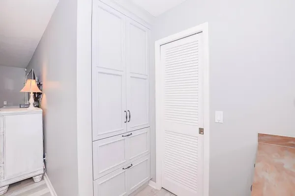 a view of a closet and utility room