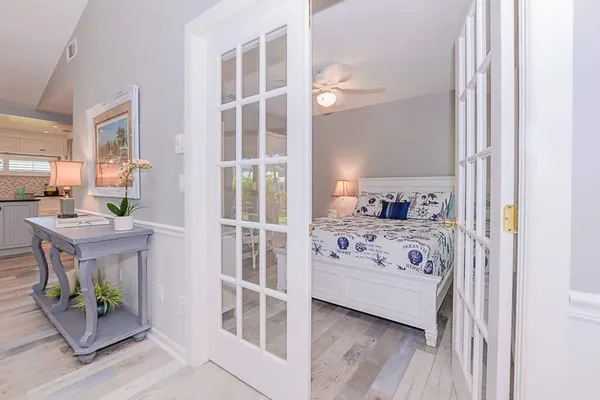 a view of a bedroom with a bed and a window