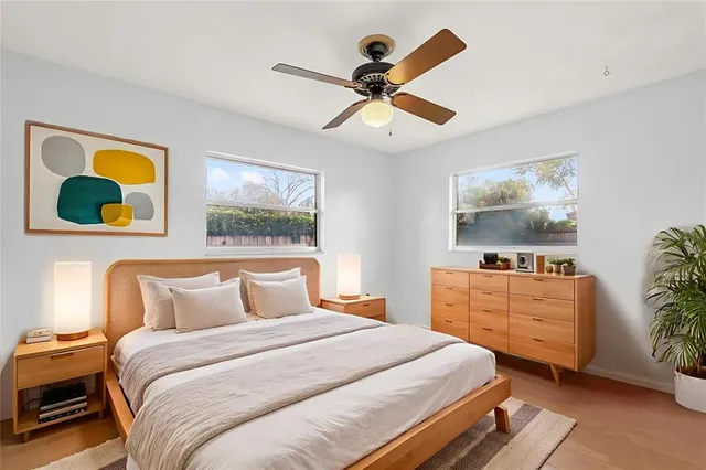 a view of a dining room with furniture large windows and wooden floor