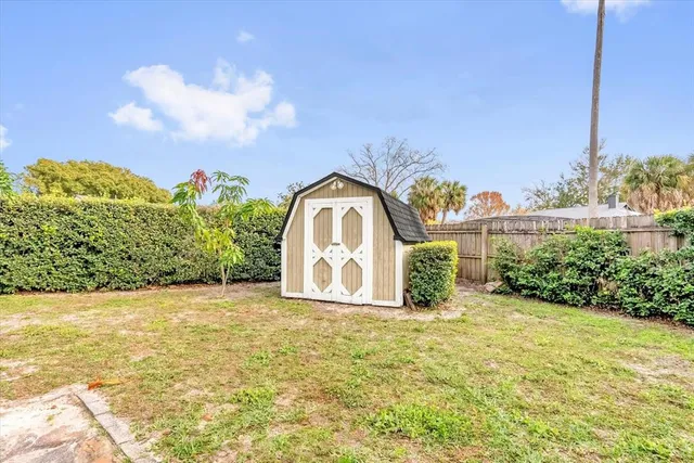 swimming pool view with a garden space