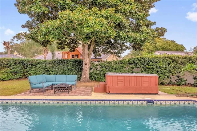 a view of outdoor space yard swimming pool and outdoor seating
